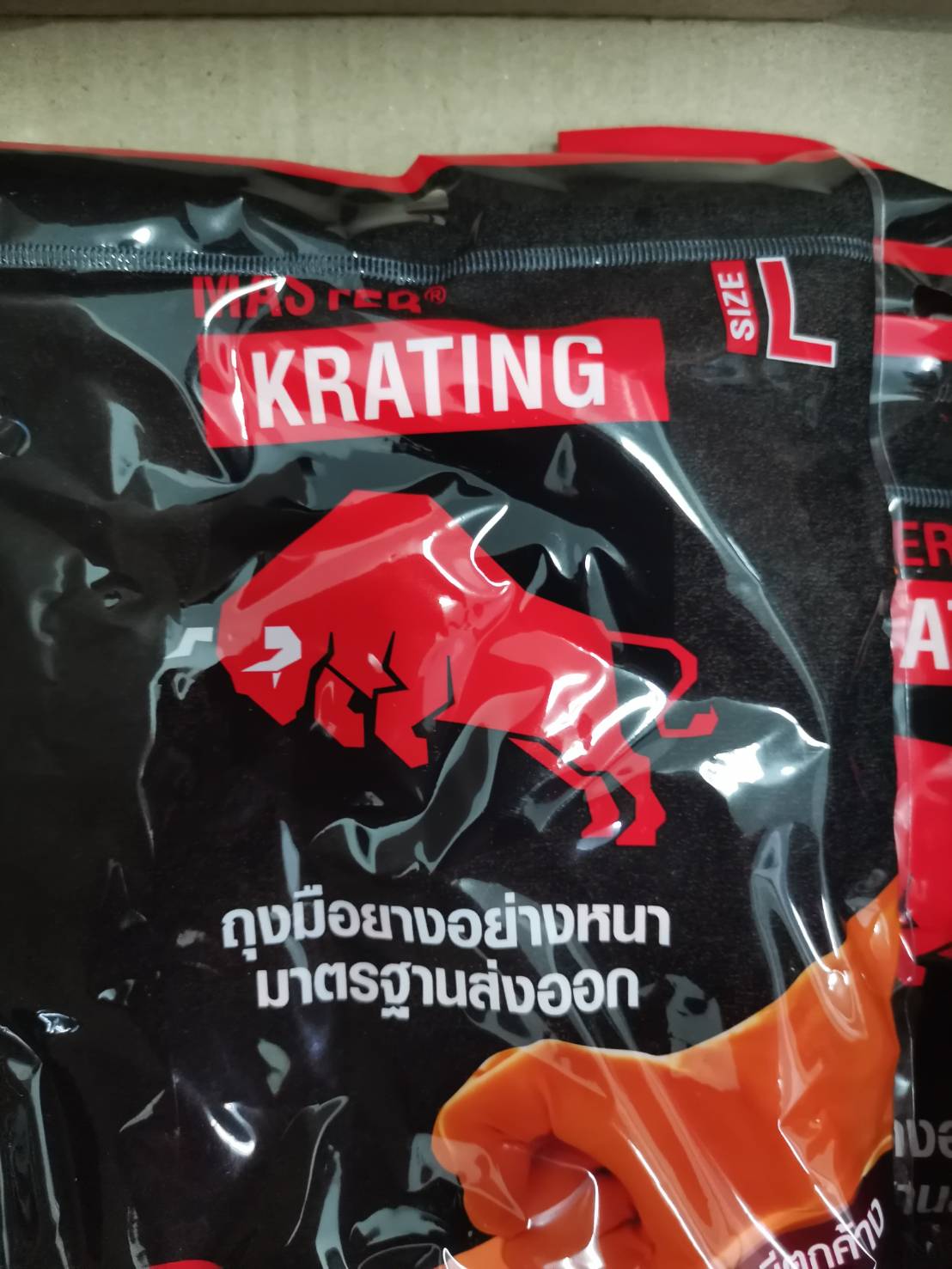 ถุงมือยางสีส้ม ตรากระทิง