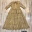 Landmee' Dress :: แม็กซี่เดรสสีทองตัวยาวคอกลมแขนสั้นระบาย แต่งผ้าผูกโบว์ที่คอ